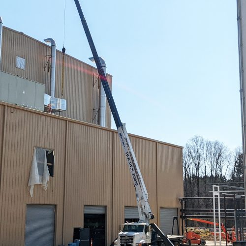 Setting HVAC components with boom truck